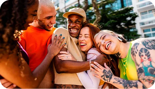 group of people hugging and smiling